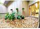 Outdoor courtyard features hanging plants and decorative rock at 1407 Willow Oak Cir, Bradenton, FL 34209