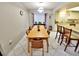 Cozy dining area featuring a wooden table and a bay window to let in natural light at 1407 Willow Oak Cir, Bradenton, FL 34209