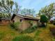 Side view of home with mature landscaping at 1407 Willow Oak Cir, Bradenton, FL 34209