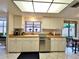 Well-lit kitchen with white cabinetry and stainless steel appliances at 1407 Willow Oak Cir, Bradenton, FL 34209