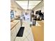 Kitchen with white cabinets, tile floors, stainless steel appliances, and lots of natural light at 1407 Willow Oak Cir, Bradenton, FL 34209
