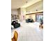 Bright and open living area features tile floors, vaulted ceilings, access to other rooms, and natural light at 1407 Willow Oak Cir, Bradenton, FL 34209