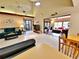 Bright living room features tile floors, high ceilings, and an open design with backyard views at 1407 Willow Oak Cir, Bradenton, FL 34209