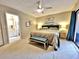 Main bedroom features neutral colors, ensuite bath, and slider door at 1407 Willow Oak Cir, Bradenton, FL 34209