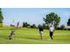 Golfers on the golf course enjoying a sunny day at 16904 Vardon Ter # 102, Bradenton, FL 34211