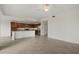 Bright living room and kitchen space with tile floors and stainless steel appliances at 16904 Vardon Ter # 102, Bradenton, FL 34211