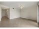 Spacious living room with tile flooring, ceiling fan, and bright natural light at 16904 Vardon Ter # 102, Bradenton, FL 34211