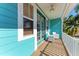Outdoor seating area with a table, chairs, and tropical views at 312 61St St # A, Holmes Beach, FL 34217