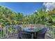 Outdoor living space with a dining table and lush tropical landscaping at 312 61St St # A, Holmes Beach, FL 34217