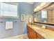 Stylish bathroom with a granite countertop vanity and an ornate mirror at 312 61St St # A, Holmes Beach, FL 34217