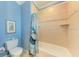 Clean bathroom featuring a tiled shower/tub combination and a turtle themed shower curtain at 312 61St St # A, Holmes Beach, FL 34217