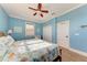 Comfortable bedroom featuring wood floors, a ceiling fan, and a closet at 312 61St St # A, Holmes Beach, FL 34217