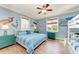 Bedroom featuring bunk beds, a ceiling fan, and coastal-themed decor at 312 61St St # A, Holmes Beach, FL 34217