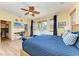 Bright bedroom featuring a ceiling fan, private balcony and a dedicated workspace at 312 61St St # A, Holmes Beach, FL 34217