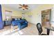 A bedroom featuring a ceiling fan, and a blue upholstered bench at the end of the bed at 312 61St St # A, Holmes Beach, FL 34217