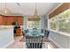 Dining area includes a dining table with seating for eight and lots of natural light at 312 61St St # A, Holmes Beach, FL 34217