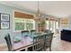 Bright and airy dining room offers plenty of light and charming coastal decor at 312 61St St # A, Holmes Beach, FL 34217