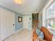 Light-filled entryway showcases tile floors, stairs, doors and wicker bench at 312 61St St # A, Holmes Beach, FL 34217