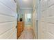 Hallway with wood floors, a chest of drawers and access to closets and a bathroom at 312 61St St # A, Holmes Beach, FL 34217