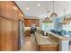 Bright kitchen features granite counters, stainless appliances, and wood cabinets at 312 61St St # A, Holmes Beach, FL 34217