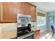 The kitchen features a stainless steel microwave and oven, and granite counters at 312 61St St # A, Holmes Beach, FL 34217