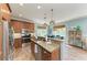 Bright kitchen features granite counters, stainless appliances, and wood cabinets at 312 61St St # A, Holmes Beach, FL 34217