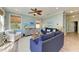 Spacious living room filled with natural light, comfortable seating, and coastal decor at 312 61St St # A, Holmes Beach, FL 34217
