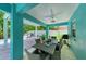 Outdoor dining and living space with a table, chairs, and grill at 312 61St St # A, Holmes Beach, FL 34217