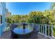 Outdoor patio featuring a wicker table and chairs with a lush tropical landscape view at 312 61St St # A, Holmes Beach, FL 34217