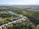 Aerial view of homes in a lush community with ponds, trees and easy access to highways at 5718 Broad River Run, Ellenton, FL 34222