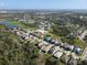Expansive aerial view of a community featuring various housing styles, ponds and green spaces at 5718 Broad River Run, Ellenton, FL 34222