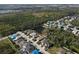 Aerial view of homes with pond views in a tranquil community near wooded areas and highways at 5718 Broad River Run, Ellenton, FL 34222
