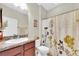 This bathroom features a vanity with a granite countertop, a toilet, and a shower-tub combination at 5718 Broad River Run, Ellenton, FL 34222