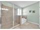 Bathroom featuring walk-in shower, soaking tub, and neutral color scheme at 5718 Broad River Run, Ellenton, FL 34222