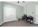 Bedroom with a ceiling fan, closet, wood floors, desk, and chair at 5718 Broad River Run, Ellenton, FL 34222