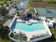 Aerial view of the community pool and clubhouse offering residents leisure and recreational amenities at 5718 Broad River Run, Ellenton, FL 34222