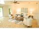 Inviting living room with tile flooring, neutral decor, and comfortable seating at 5718 Broad River Run, Ellenton, FL 34222