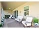 Screened patio with seating area and view of backyard at 5718 Broad River Run, Ellenton, FL 34222