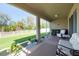 Screened patio with seating area and view of backyard at 5718 Broad River Run, Ellenton, FL 34222