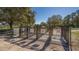 Entrance to a secure and well-maintained dog park with separate entrance and exit gates at 6373 Royal Tern Cir, Lakewood Ranch, FL 34202