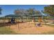 A well-maintained playground with swings and climbing area, providing outdoor recreation and fun for children in the community at 6373 Royal Tern Cir, Lakewood Ranch, FL 34202