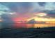 Picturesque sunset over the ocean, casting vibrant colors across the sky with a tranquil and serene view at 6796 Gasparilla Pines Blvd # 45, Englewood, FL 34224