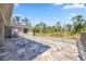 Wide open backyard features a large patio and lots of trees at 8570 Tropicaire Blvd, North Port, FL 34291