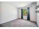 Cozy bedroom with carpet and bright window at 8570 Tropicaire Blvd, North Port, FL 34291
