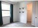 Well-lit bedroom with shelving and access to a closet, plus a window with exterior views at 8570 Tropicaire Blvd, North Port, FL 34291