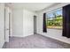 Bright bedroom with gray carpet and natural light at 8570 Tropicaire Blvd, North Port, FL 34291