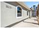 Exterior view of a home with an arched window and walkway at 8570 Tropicaire Blvd, North Port, FL 34291