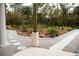 A beautiful, landscaped walkway with stone pavers and natural accents at 8570 Tropicaire Blvd, North Port, FL 34291