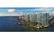 Stunning aerial view of waterfront condos with private boat docks and a refreshing pool at 888 Blvd Of The Arts # 1608, Sarasota, FL 34236