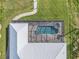 Aerial view of a lovely screened-in pool and patio area of the home at 9464 St Marys Ct, Port Charlotte, FL 33981
